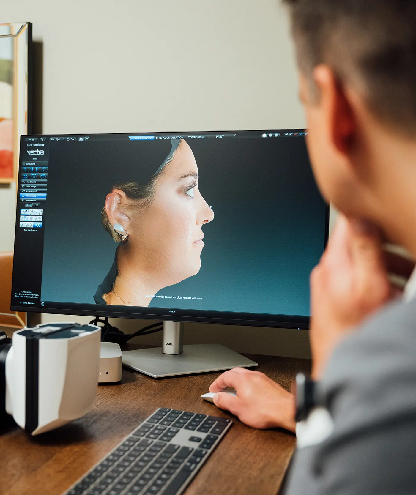 Doctor looking at patient profile on computer